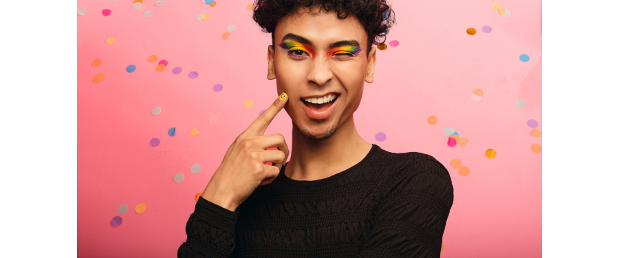 salon pride month ideas - a man in colorful pride makeup