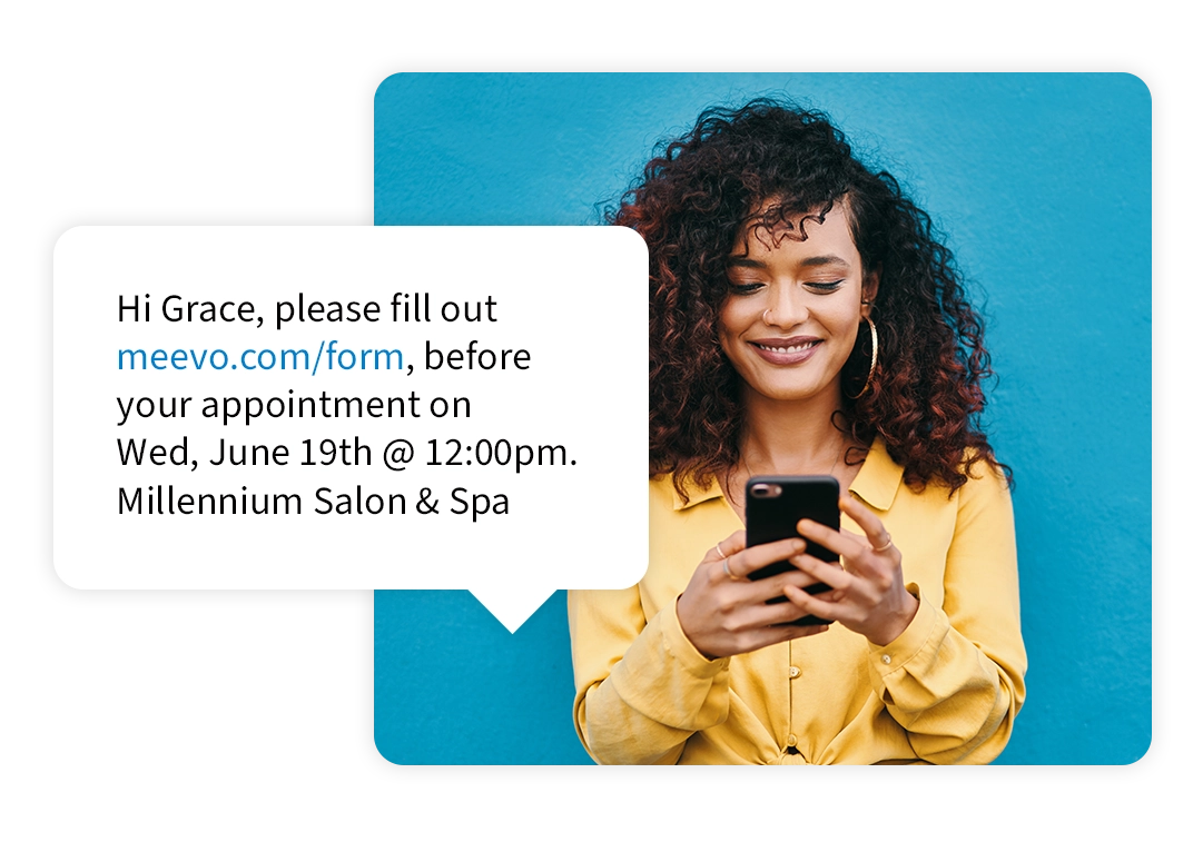 women on cell phone recieving a text message to fill out form before salon and spa appointment